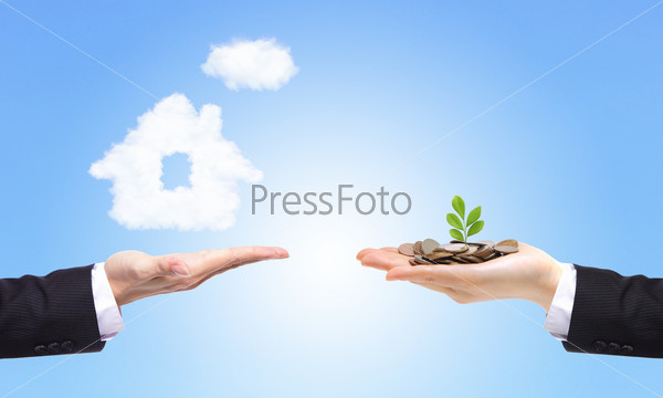 business Hands with money and house from clouds on blue sky background, concept for family and Estate concept