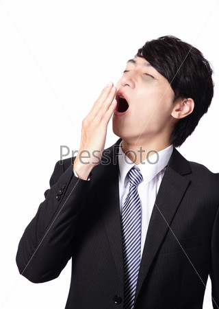 overworked business man yawning with black rim of eye, face in profile,  isolated on white background, model is a asian people