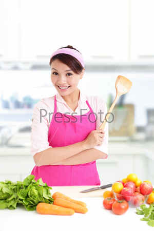 Happy smiling woman in kitchen