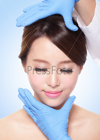 Beautiful female face with Plastic surgery glove