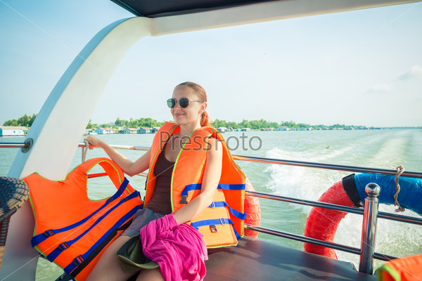 Tourist enjoying Mekong delta cruise with daily trips to local sights
