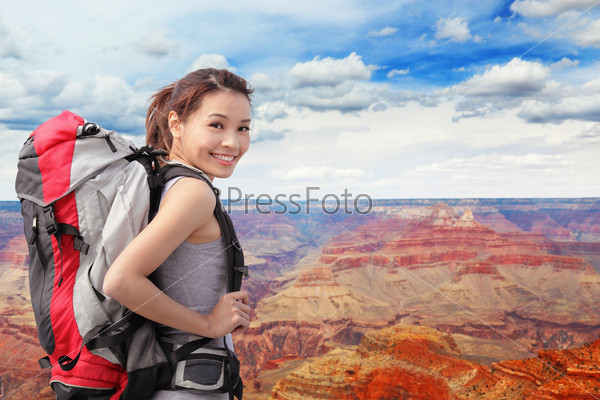 Woman mountain Hiker with backpack enjoy view in grand canyon, asian