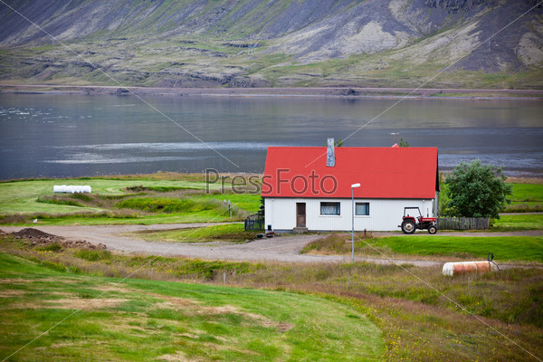 Typical Farm House at Icelandic Fjord Coast. Horizontal shot