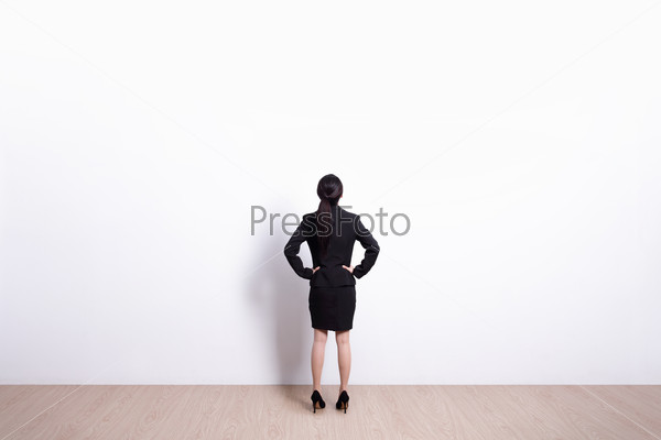Back view of business woman look white wall background, great for your design or text, asian