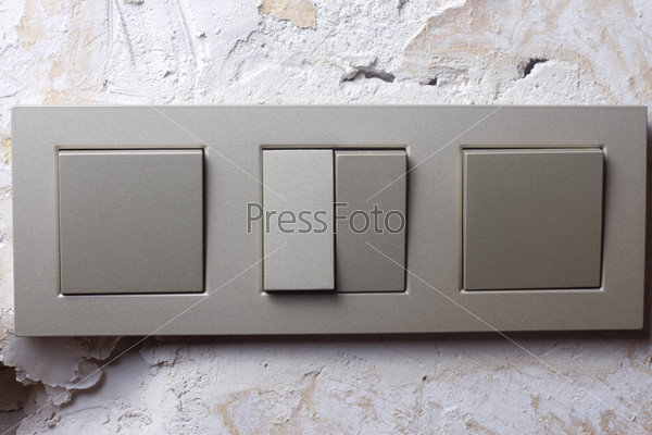 Light switch on the repaired plaster walls, stock photo