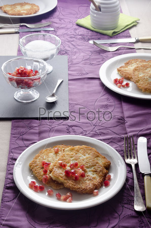 laid table with rustic potato pancakes