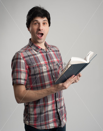 surprised man with book