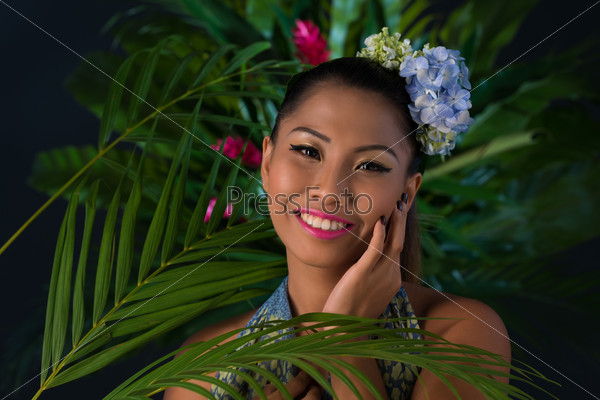 Portrait of attractive woman in jungle