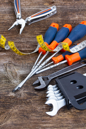 pile of colorful tools   on wooden  background