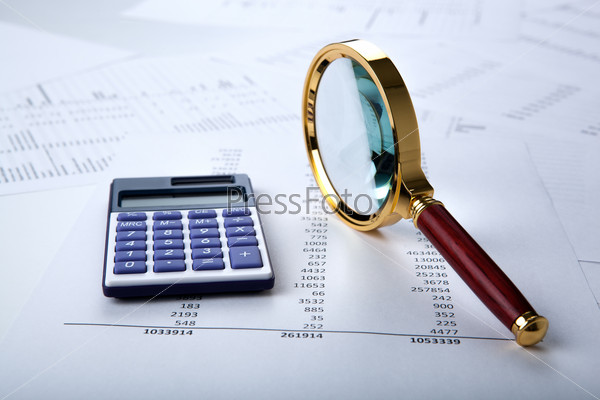 work with a magnifying glass, a calculator and papers