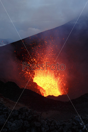 Beautiful mountain landscape: eruption volcano - fountain lava from volcano. Russia, Far East, Kamchatka Peninsula