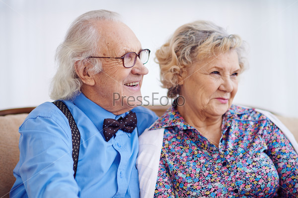 Happy aged couple in elegant clothes