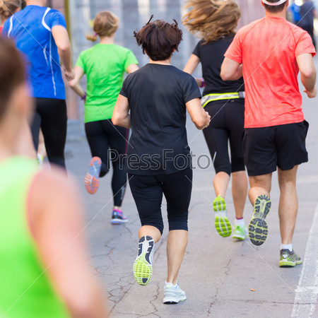 Group of active people running in the city. Healthy lifestyle. Weight Loss. Urban marathon run, stock photo