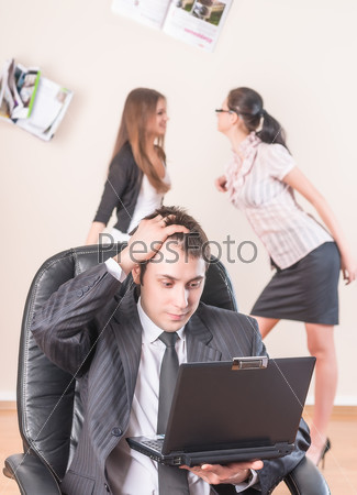 Businessman works with laptop and is distressed