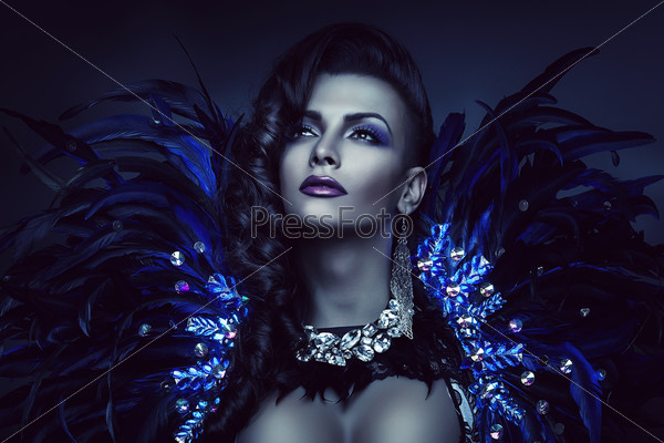 woman in blue feather and diamonds
