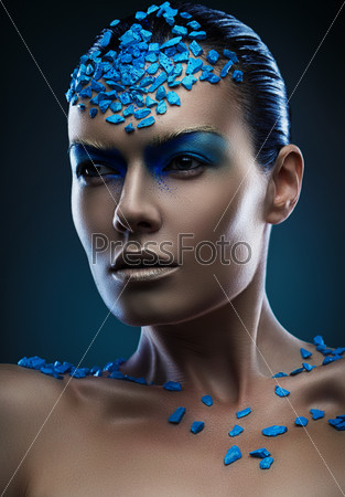 young woman with blue stones