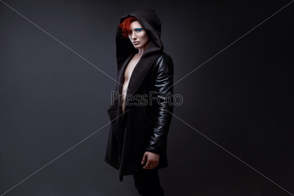 man with red hair in a coat