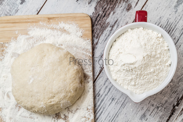 Dough recipe ingredients like eggs, flour, oil, sugar on white wooden table