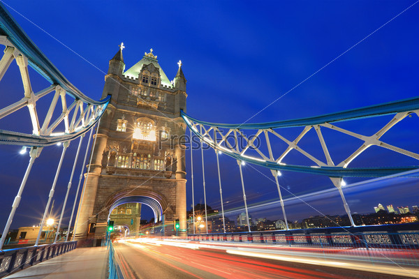 Tower Bridge at night with the lights of the cars passing by, shot in London, United Kingdom, England
