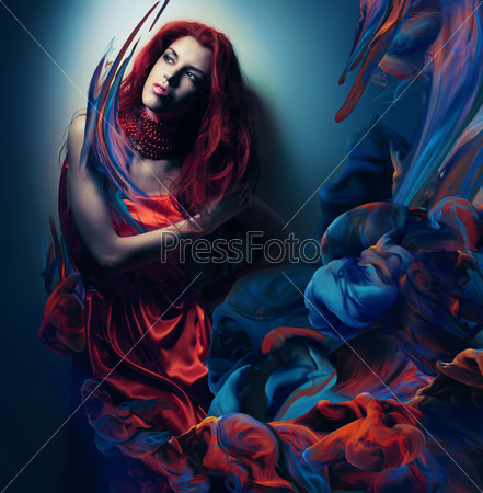 woman with red hair in paint waves