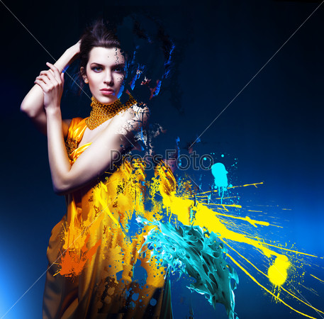 sensual sexy woman in long yellow dress and splatter