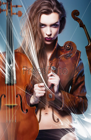pretty erotic devil woman in leather jacket with two violins