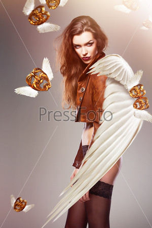 attractive sexy woman with wings and flying masks