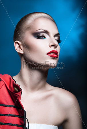 beautiful sexy blonde woman with red lips ir red jacket