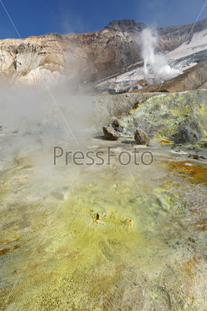Volcanic landscape of Kamchatka: brimstone and fumarole field in crater of active Mutnovsky Volcano. Russia, Far East