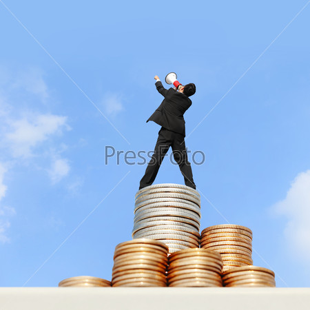 I want be rich - happy business man using megaphone shouting on money stairs with blue sky background, asian