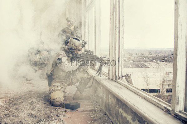United States Army rangers during the military operation in the smoke and fire