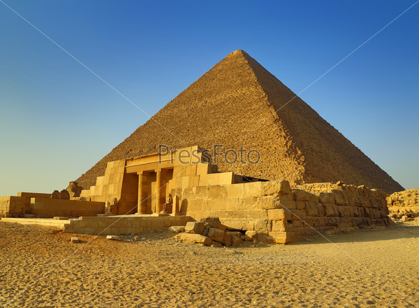 The entrance of the mastaba of Seshemnufer IV and the Great Pyramid in background. Giza, Cairo, Egypt