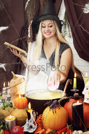 Witch throws an apple into the pot