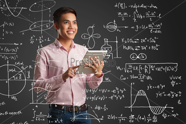 Happy Vietnamese student with a digital tablet standing in front of screen with different formulas