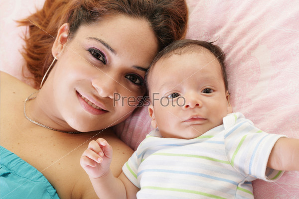 Happy latin mother with her baby