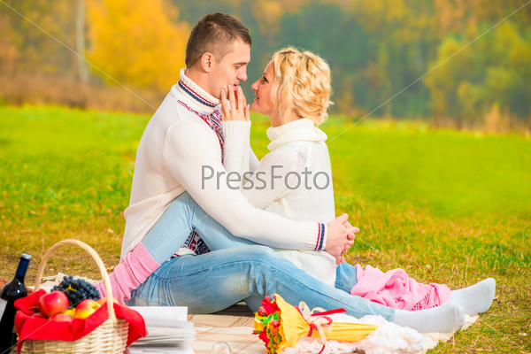 meeting loving couple in the park on a picnic