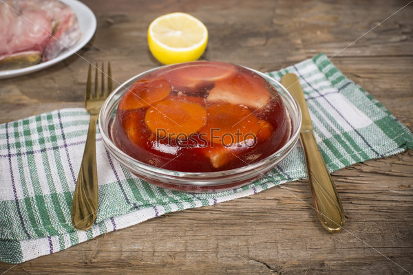 the jellied fish on the table of the old rotten boards