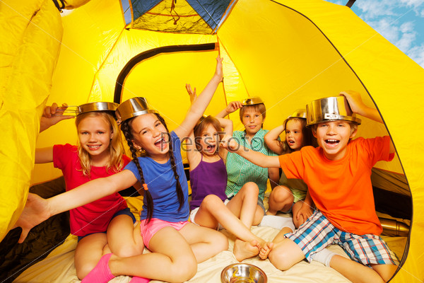 Six kids having fun in a tent