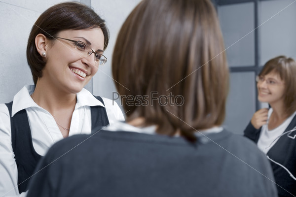 Portrait of young pretty  businesswomen in ladies room environment