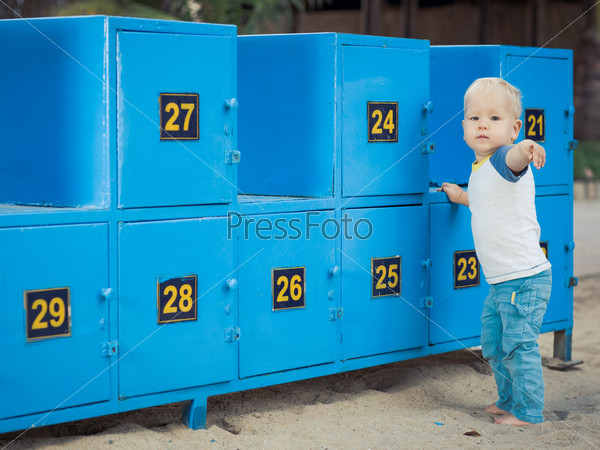 Baby stays near safety boxes