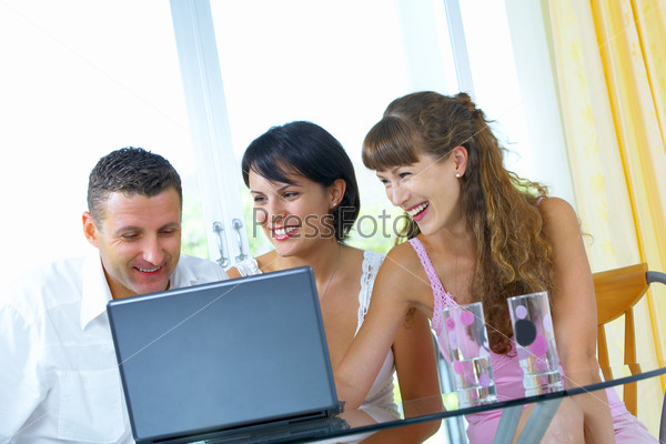 Portrait of a group of young people  with computer