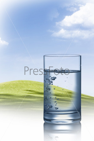close up view of water filled glass on summer background