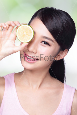 Health girl show lemon with smile face, health food concept, asian woman beauty