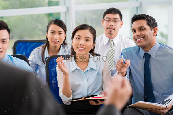 Students asking questions at lecture