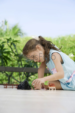 portrait of little girl   having good time in summer environment