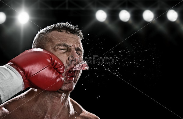 low key portrait of boxer getting knocked out