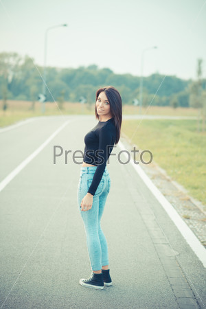 young beautiful brunette straight hair woman on the road outdoor