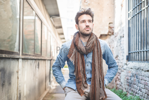 Young handsome fashion model man outdoors, stock photo