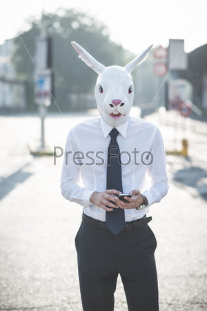 rabbit mask young handsome elegant blonde model man in the city