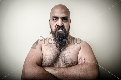 super power angry muscle bearded man  on gray background